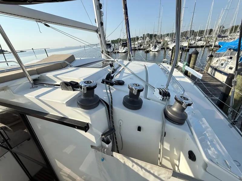 Slide: The Image of Fountaine Pajot Helia 44 catamaran deck view, 2015 model, docked at marina. - 12