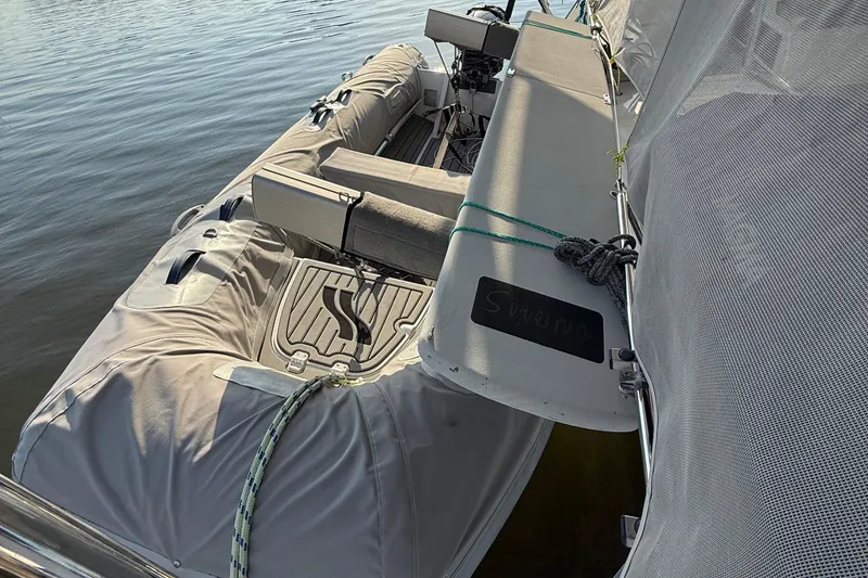 Slide: The Image of Fountaine Pajot Helia 44 catamaran, 2015 model, with covered seating area on calm water. - 20