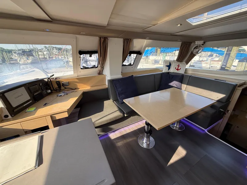 Slide: The Image of Interior of 2015 Fountaine Pajot Helia 44 catamaran with seating area and navigation station. - 24