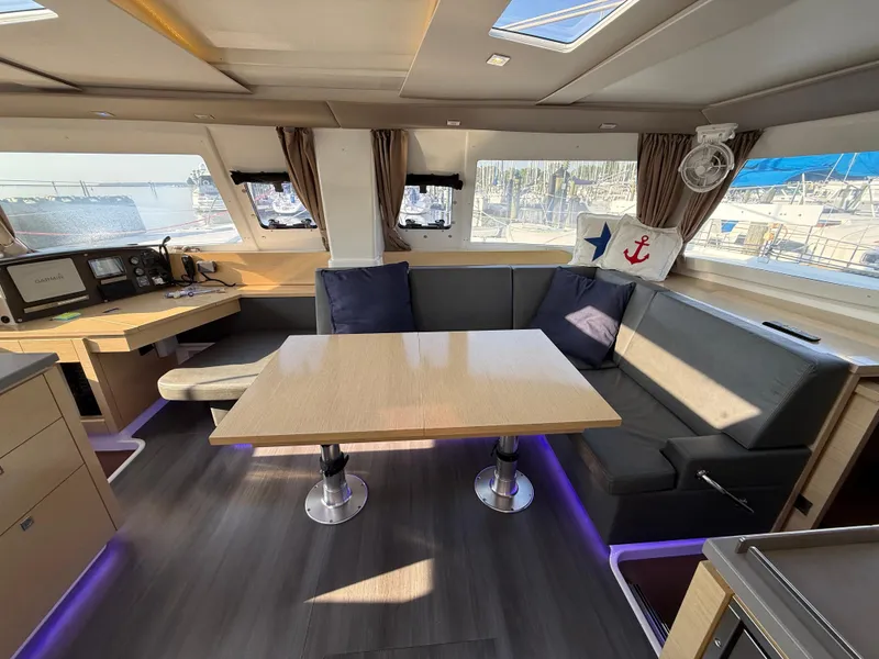 Slide: The Image of Interior of 2015 Fountaine Pajot Helia 44 catamaran with modern seating and navigation area. - 25