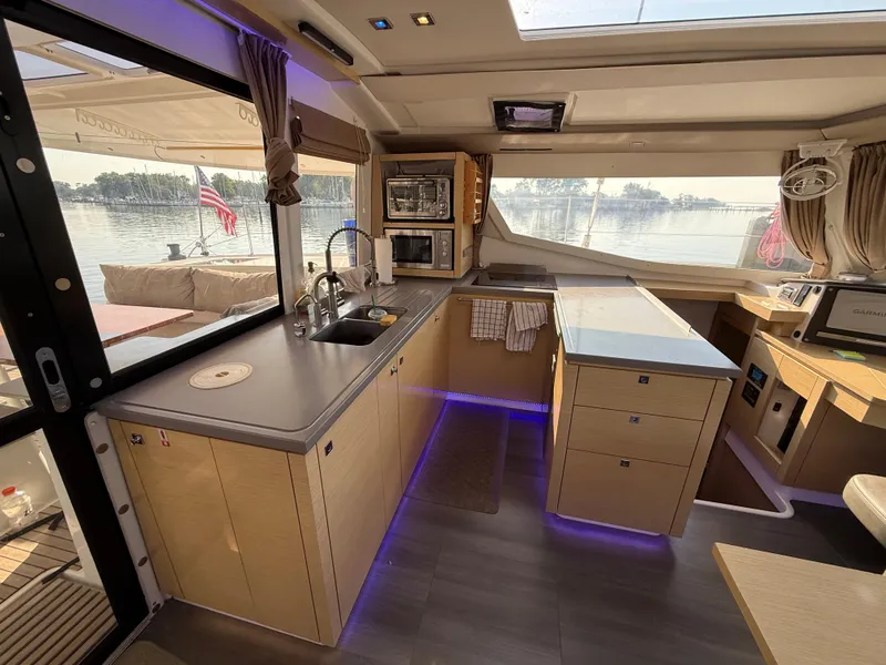 Slide: The Image of Modern kitchen interior of 2015 Fountaine Pajot Helia 44 catamaran with scenic water view. - 27