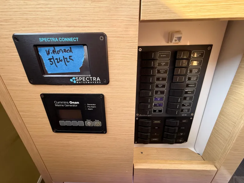 Slide: The Image of Control panel of a 2015 Fountaine Pajot Helia 44 with Spectra Watermakers and Cummins Onan generator. - 33