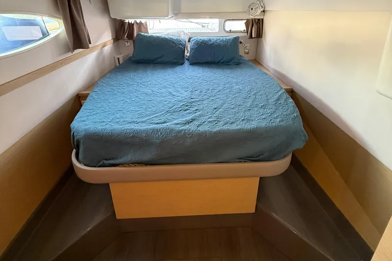 Slide: The Image of Cozy bedroom interior of 2015 Fountaine Pajot Helia 44 catamaran with blue bedding. - 35
