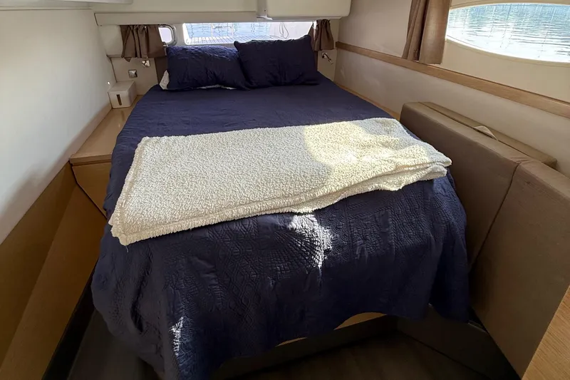 Slide: The Image of Cozy bedroom interior of 2015 Fountaine Pajot Helia 44 catamaran with plush bedding. - 43