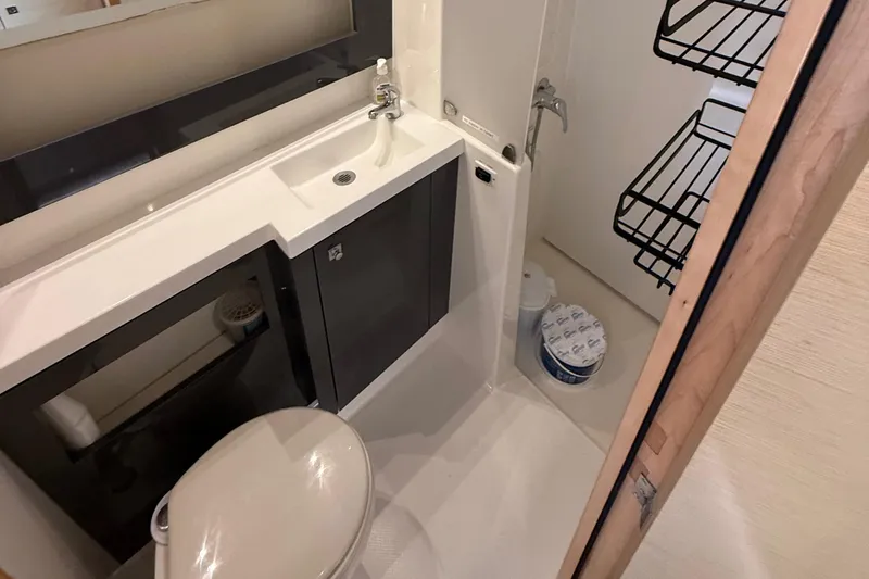 Slide: The Image of Bathroom interior of 2015 Fountaine Pajot Helia 44 catamaran, featuring sink and toilet. - 44
