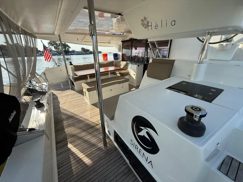 Slide: The Image of Spacious deck of 2015 Fountaine Pajot Helia 44 catamaran with seating and helm station. - 6