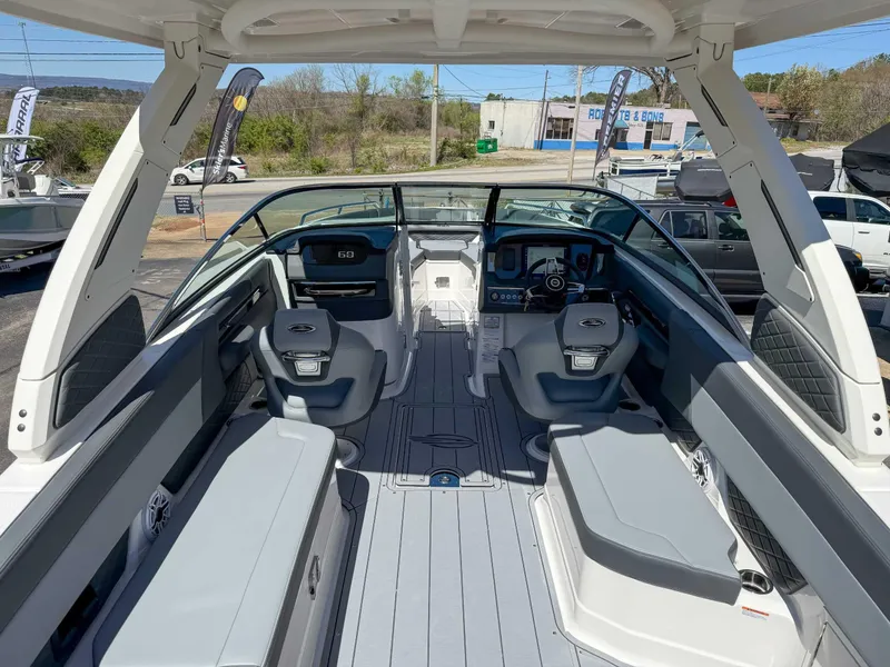 Slide: The Image of 2025 Chaparral 2870 SSX boat interior with modern seating and dashboard. - 12