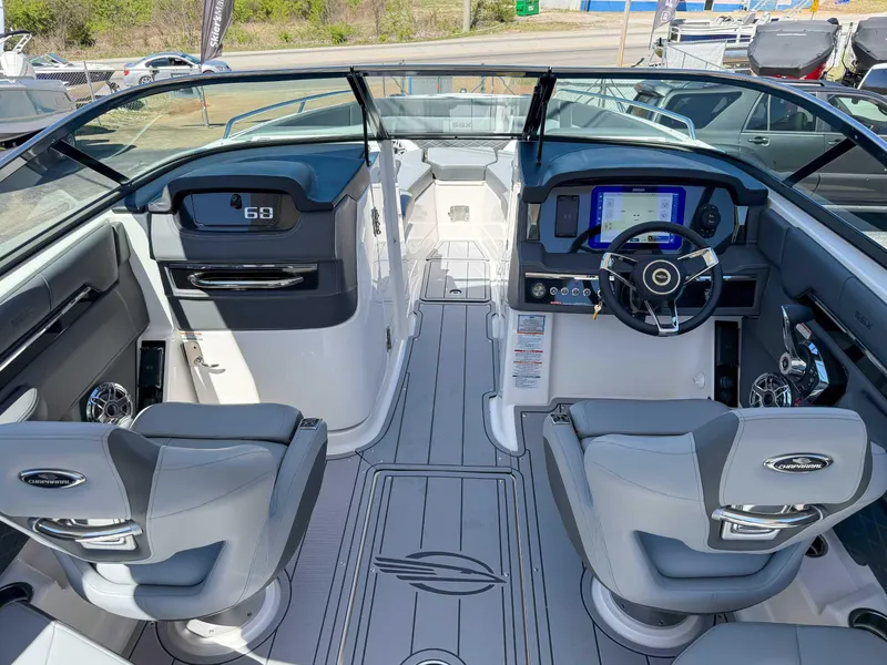 Slide: The Image of Interior of 2025 Chaparral 2870 SSX boat with modern dashboard and seating. - 13