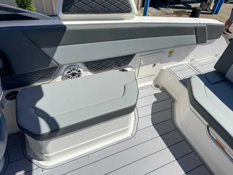 Slide: The Image of Interior seating of 2025 Chaparral 2870 SSX boat, featuring gray upholstery and modern design. - 20