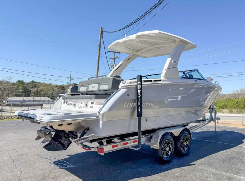 Slide: The Image of 2025 Chaparral 2870 SSX boat on trailer, sleek design, outdoor setting. - 7