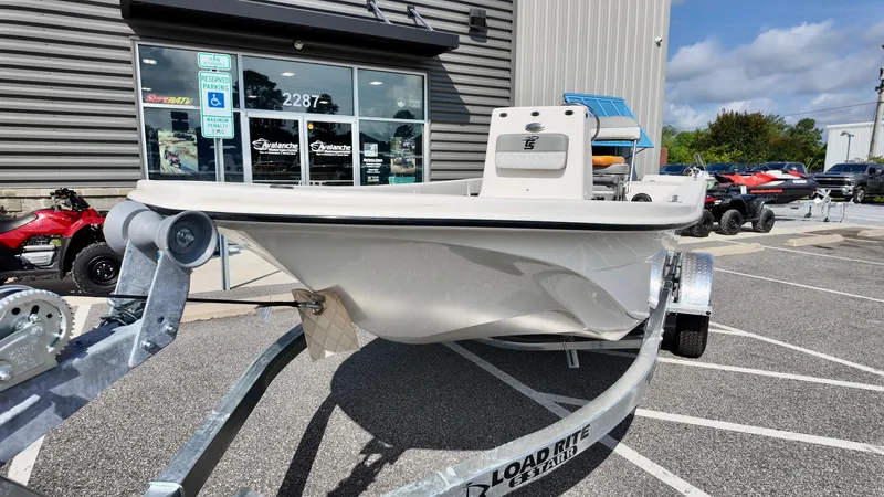 Slide: The Image of 2025 Carolina Skiff E18 JVX CC boat on trailer outside dealership. - 12