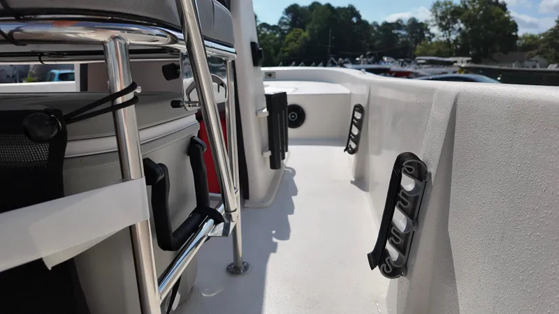 Slide: The Image of 2025 Carolina Skiff E18 JVX CC interior with storage and seating features. - 2