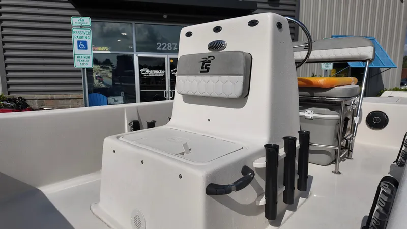 Slide: The Image of 2025 Carolina Skiff E18 JVX CC boat interior with seating and storage compartments. - 6