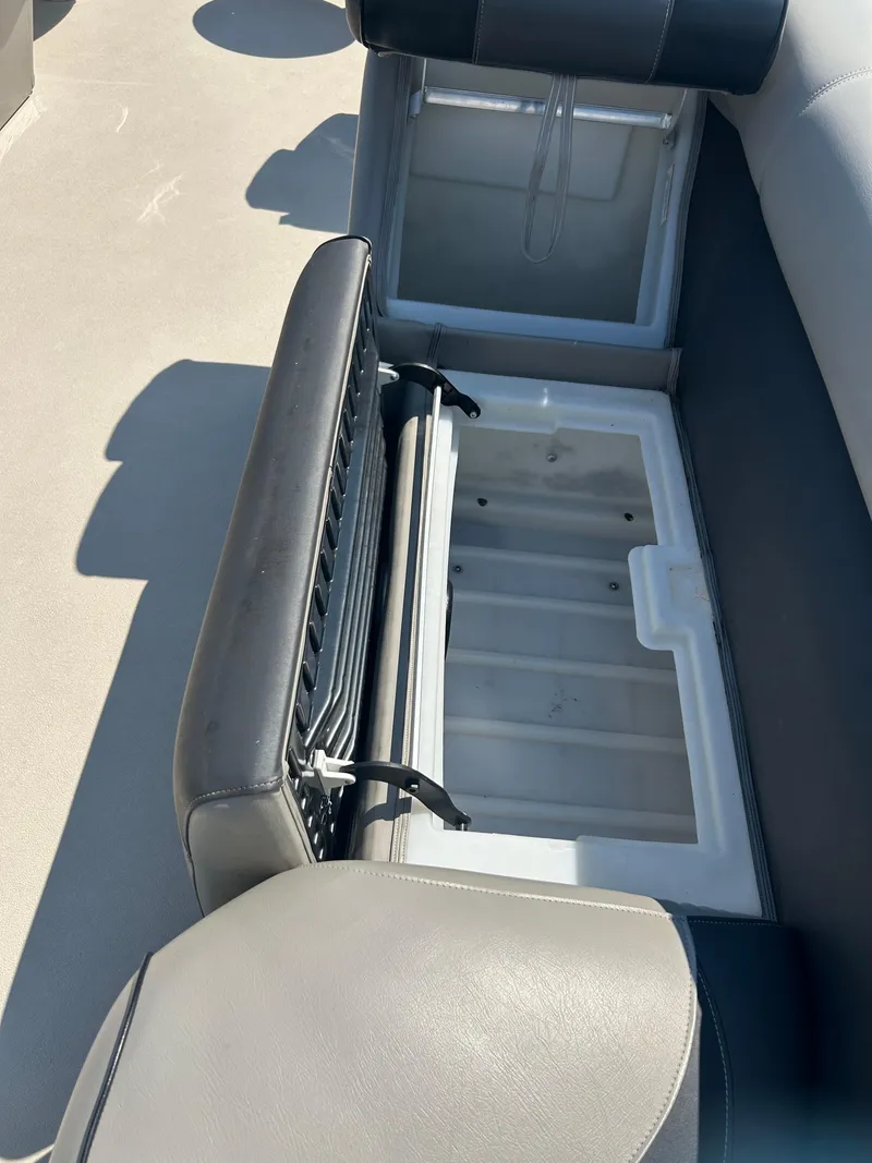 Slide: The Image of Open storage compartment in 2014 Premier 220 SunSation boat seat. - 14