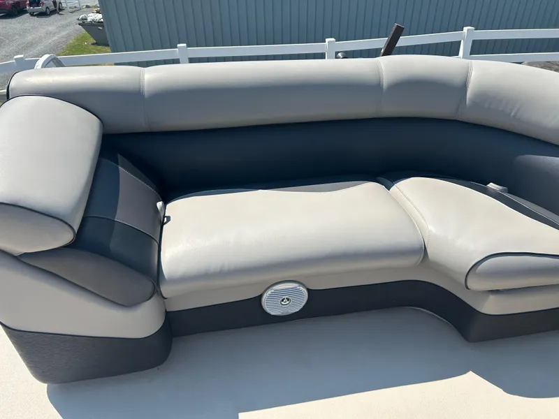 Slide: The Image of 2014 Premier 220 SunSation boat seat with gray upholstery and speaker. - 15