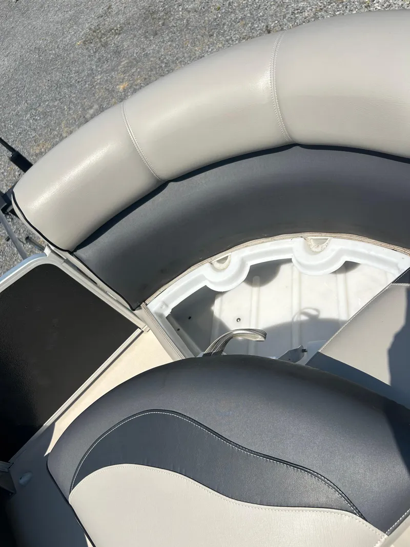 Slide: The Image of 2014 Premier 220 SunSation boat seating with gray and white upholstery. - 16