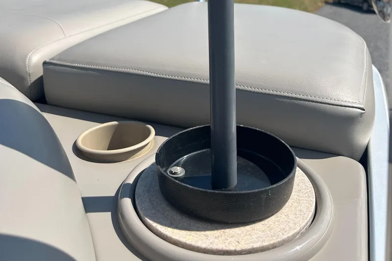 Slide: The Image of 2014 Premier 220 SunSation boat interior with cup holder and seating detail. - 22