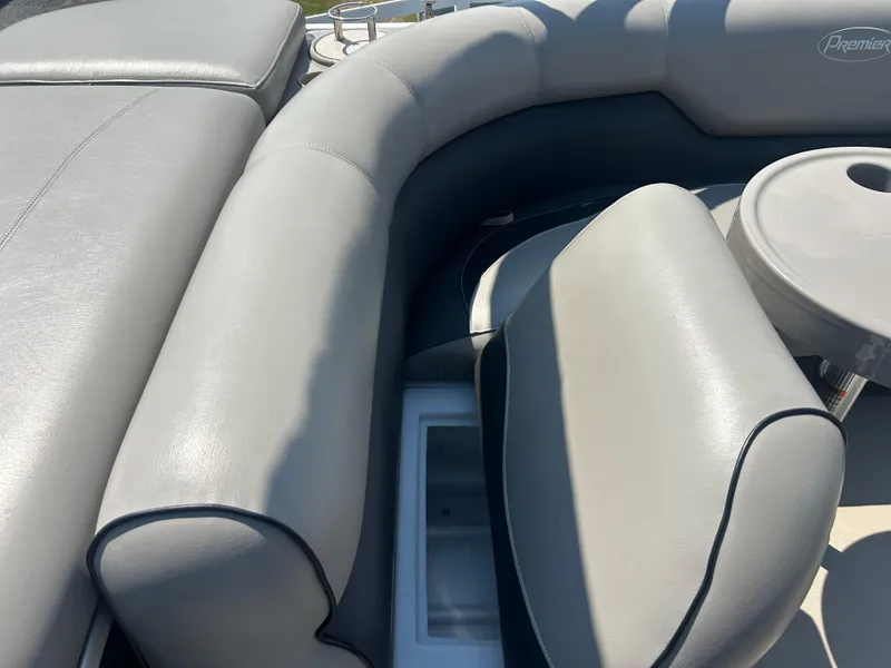 Slide: The Image of 2014 Premier 220 SunSation boat interior with gray leather seating and cup holder. - 23
