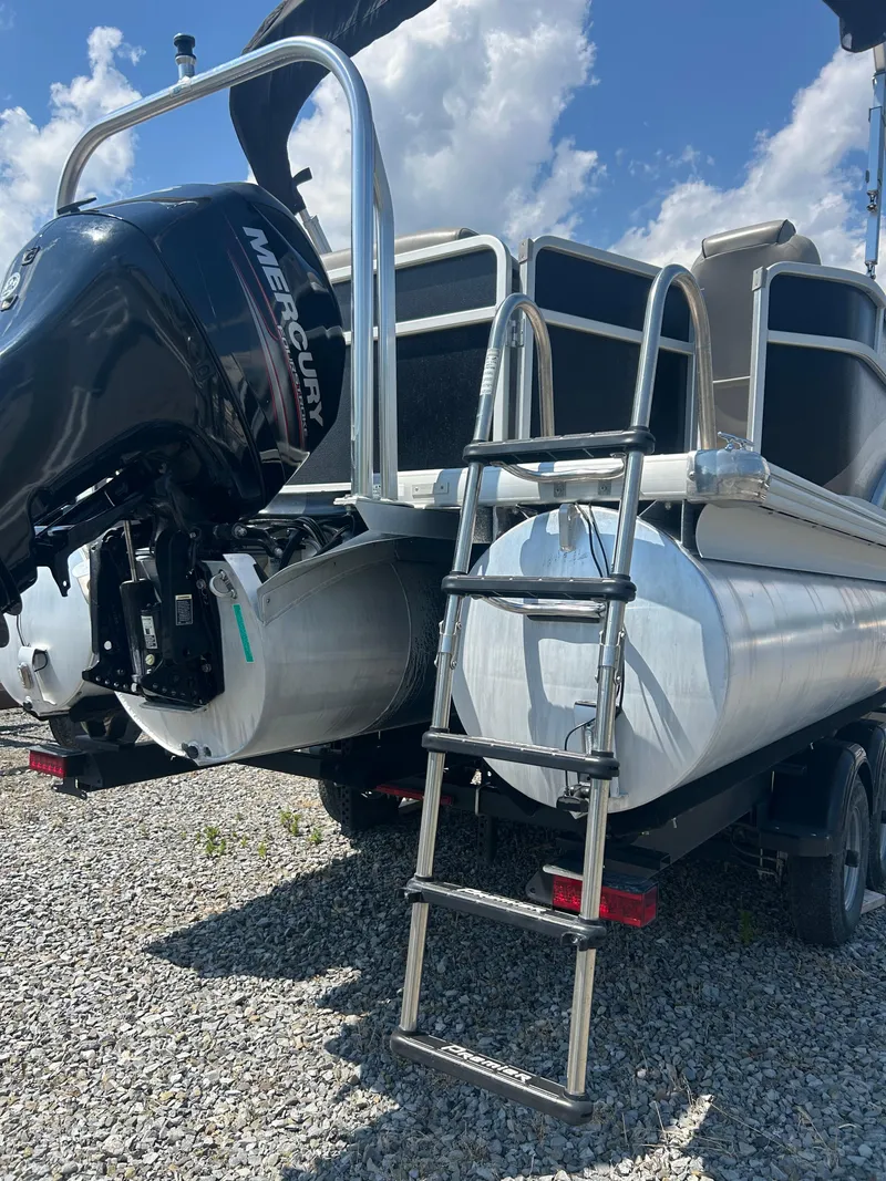 Slide: The Image of 2014 Premier 220 SunSation pontoon boat with Mercury outboard motor and ladder. - 30