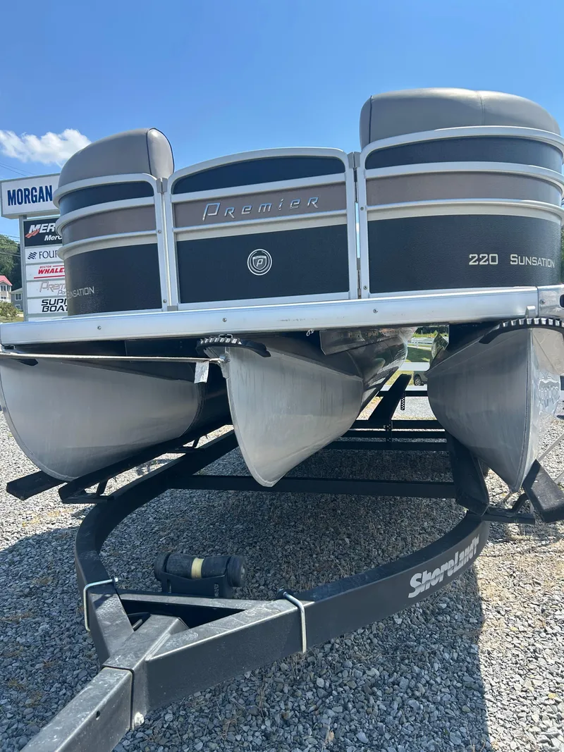 Slide: The Image of 2014 Premier 220 SunSation pontoon boat on trailer, parked on gravel. - 32