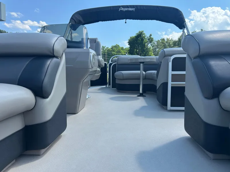 Slide: The Image of 2014 Premier 220 SunSation pontoon boat interior with plush seating and canopy. - 9