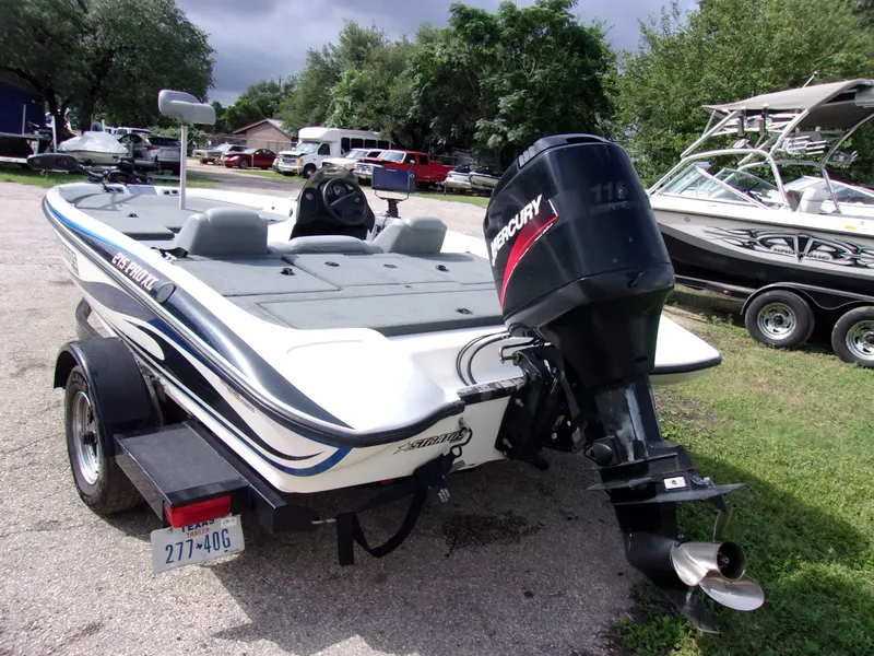 Slide: The Image of 2004 Stratos 275 Pro XL boat with Mercury engine on trailer. - 4