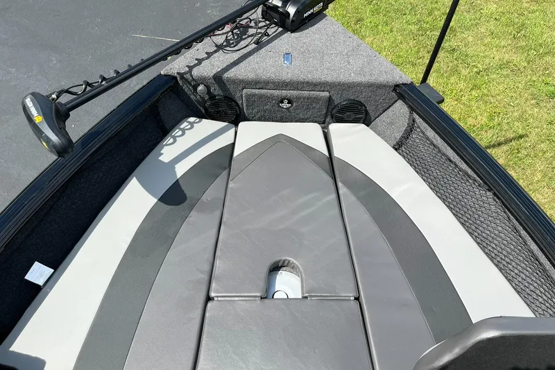 Slide: The Image of 2026 Lund 1775 Impact XS Sport boat interior with Minn Kota trolling motor. - 13