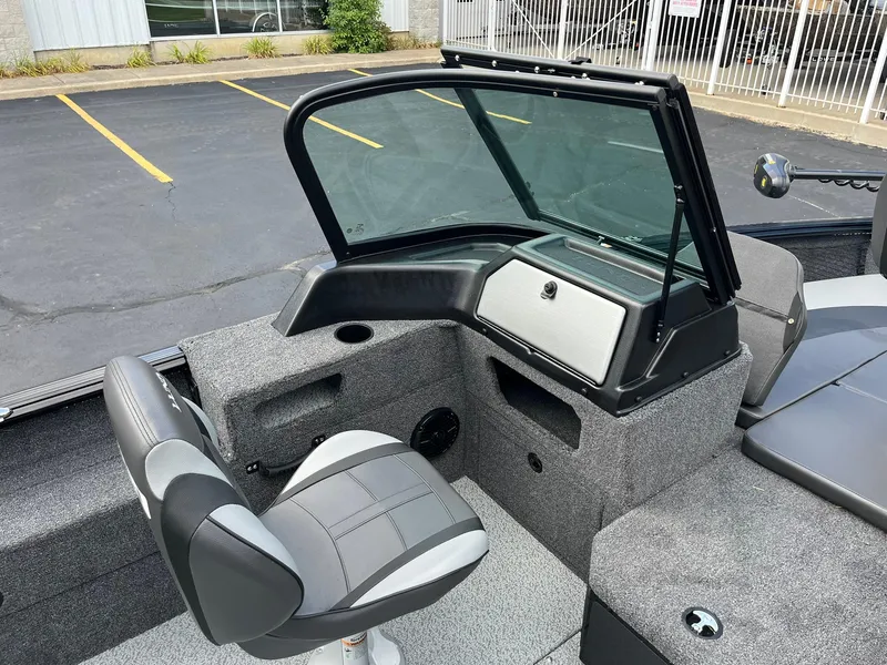 Slide: The Image of 2026 Lund 1775 Impact XS Sport boat interior with seating and dashboard. - 16