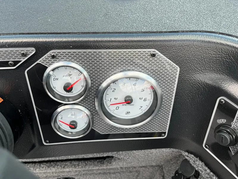 Slide: The Image of Dashboard of 2026 Lund 1775 Impact XS Sport with gauges and controls. - 18