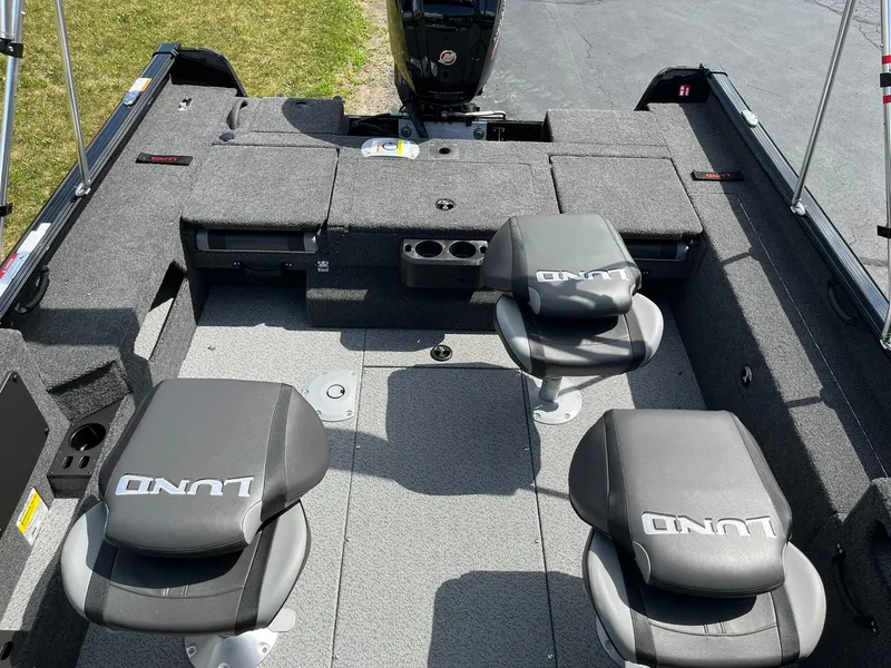 Slide: The Image of 2026 Lund 1775 Impact XS Sport boat interior with seating and storage compartments. - 7