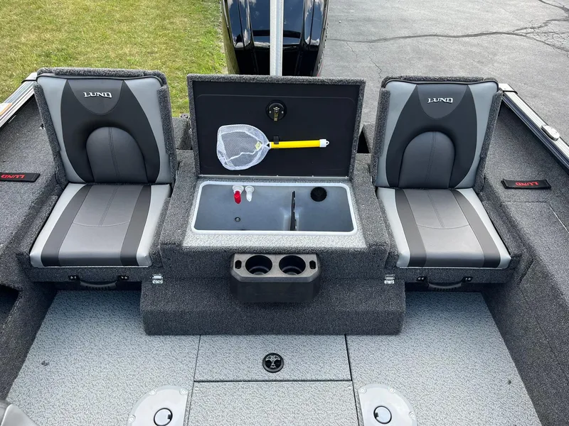 Slide: The Image of 2026 Lund 1775 Impact XS Sport boat interior with seating and storage compartments. - 8