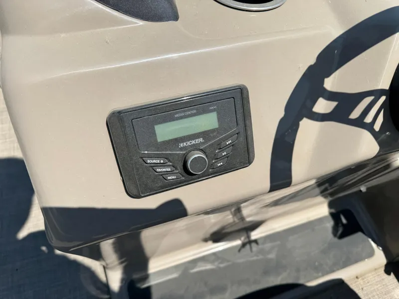 Slide: The Image of 2023 Sun Tracker SportFish 22 DLX dashboard with Kicker media center. - 13