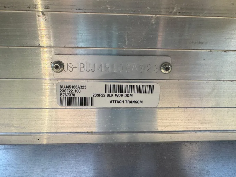 Slide: The Image of 2023 Sun Tracker SportFish 22 DLX boat identification plate with serial number and barcode. - 6