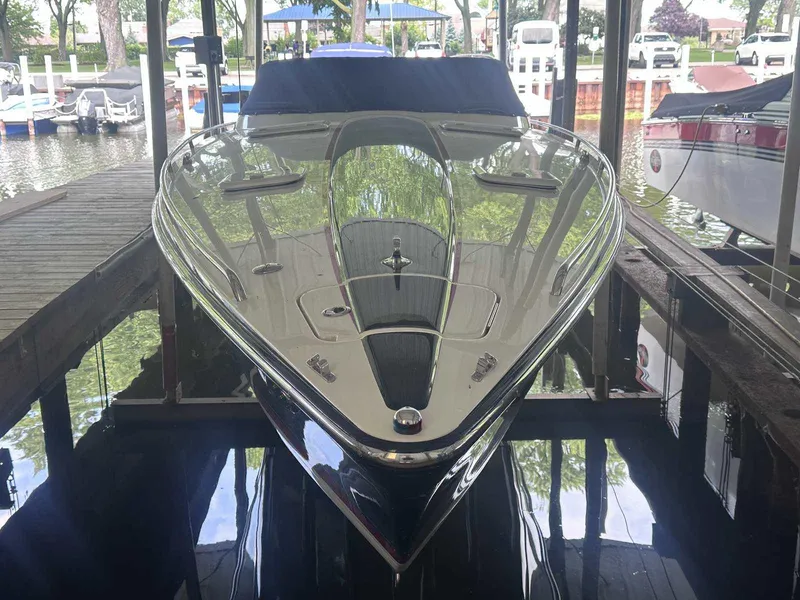 Slide: The Image of 2017 Formula 353 FASTech boat docked in a marina, reflecting on calm water. - 10