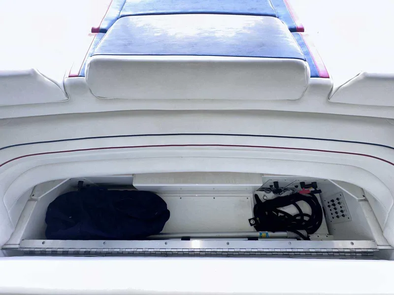 Slide: The Image of 2017 Formula 353 FASTech boat storage compartment with equipment and bag. - 15