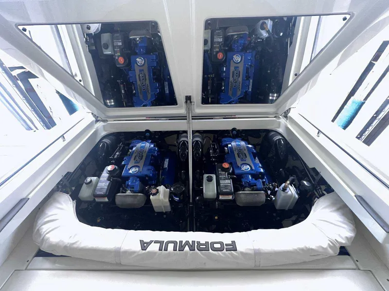 Slide: The Image of Engine compartment of a 2017 Formula 353 FASTech boat, featuring dual blue engines. - 16