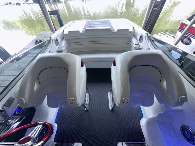 Slide: The Image of 2017 Formula 353 FASTech boat interior with white seating and red steering wheel. - 19