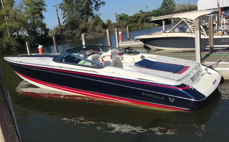 Slide: The Image of 2017 Formula 353 FASTech boat docked in a marina, featuring sleek design and vibrant colors. - 3