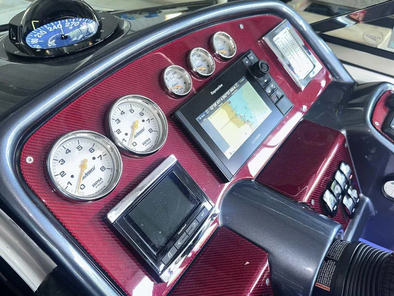 Slide: The Image of Dashboard of 2017 Formula 353 FASTech with gauges and navigation system. - 32