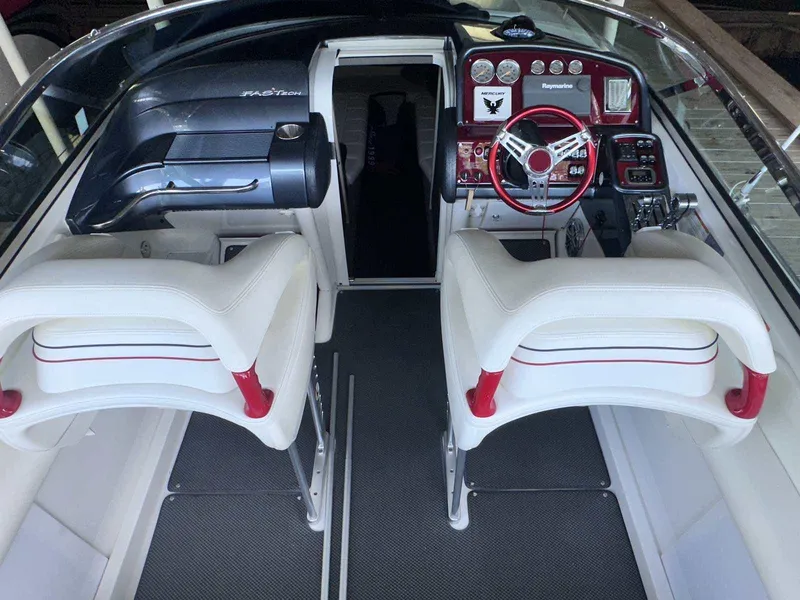 Slide: The Image of 2017 Formula 353 FASTech boat interior with white seats and red-accented dashboard. - 34