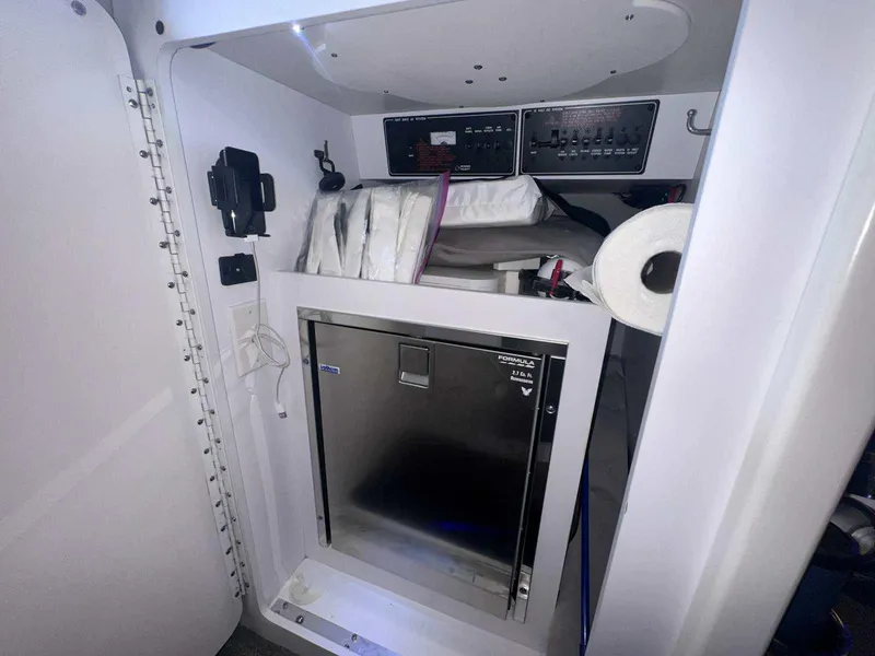 Slide: The Image of Interior of a 2017 Formula 353 FASTech boat with storage and control panels. - 36