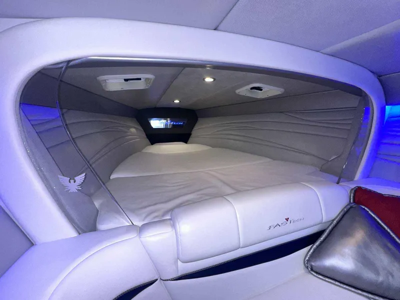 Slide: The Image of 2017 Formula 353 FASTech cabin interior with sleek white upholstery and ambient lighting. - 38