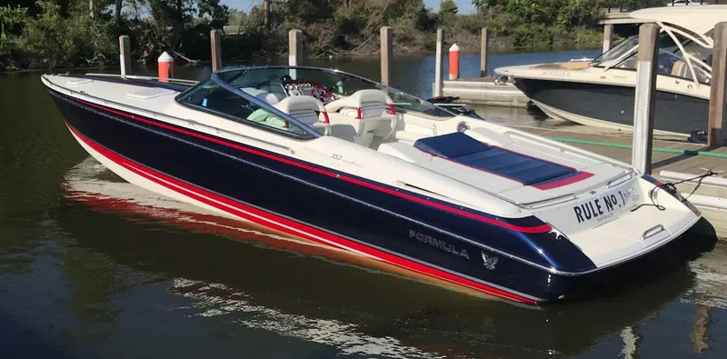 Slide: The Image of 2017 Formula 353 FASTech boat docked on calm water. - 4