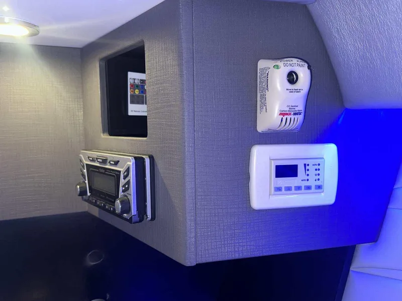 Slide: The Image of Interior controls of a 2017 Formula 353 FASTech boat, featuring a stereo and CO detector. - 42