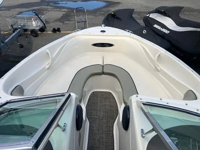 Slide: The Image of 2005 Sea Ray 185 Sport boat interior with seating and windshield. - 3