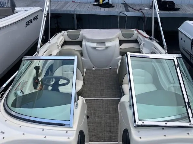 Slide: The Image of 2005 Sea Ray 185 Sport boat interior with open seating and steering wheel. - 4