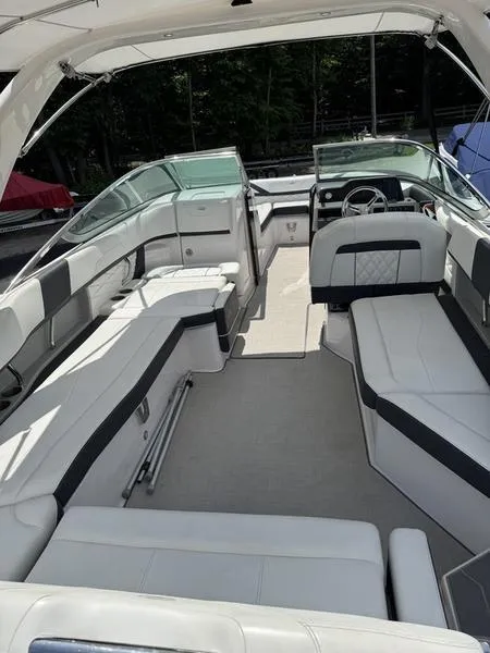Slide: The Image of 2020 Regal 26 OBX boat interior with white seating and modern design. - 6