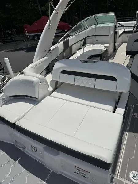 Slide: The Image of 2020 Regal 26 OBX boat interior with white seating and modern design. - 9
