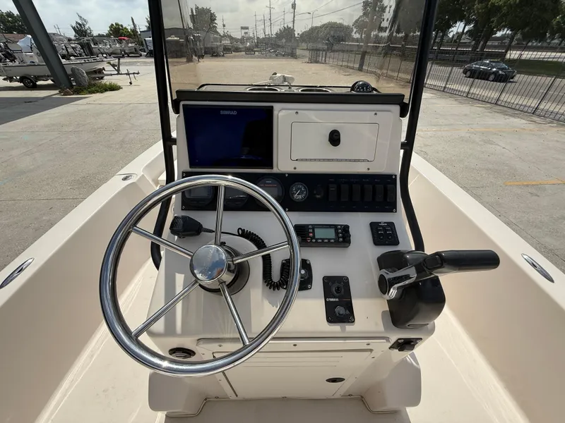 Slide: The Image of 2006 Pathfinder 2200v boat console with steering wheel and navigation controls. - 10