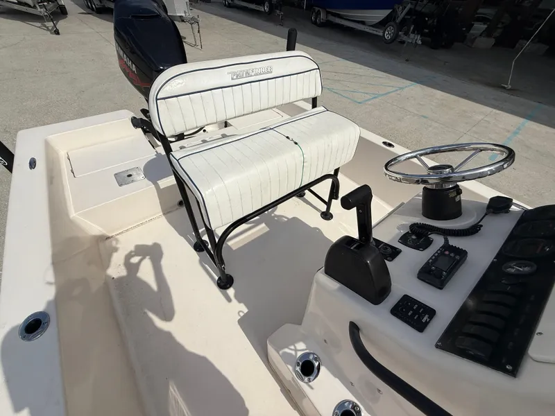 Slide: The Image of 2006 Pathfinder 2200v boat interior with steering wheel and seating. - 12
